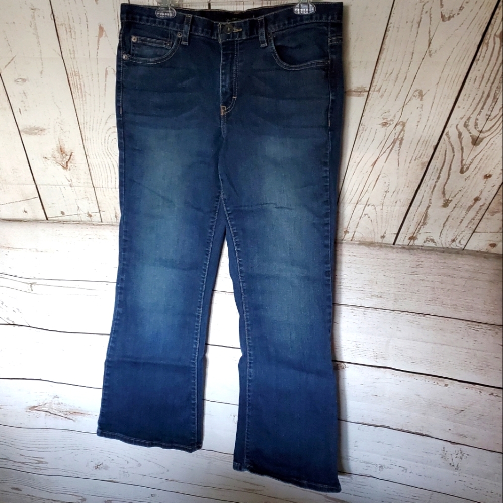 Calvin Klein mid rise dark wash flare leg five pocket jeans blue size 12